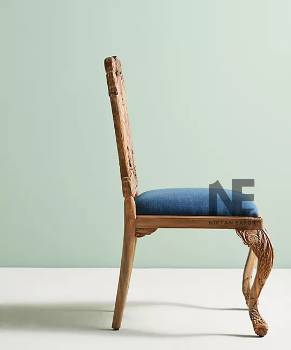 Ornate owl motif on wooden chair backrest
