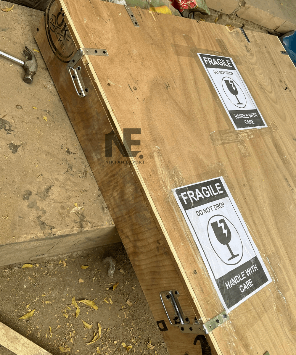 Wooden box showing “Fragile – Handle with Care” labeling