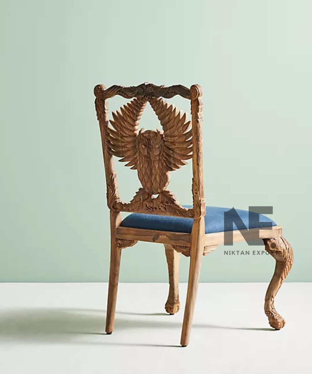 Close-up of hand-carved owl chair back