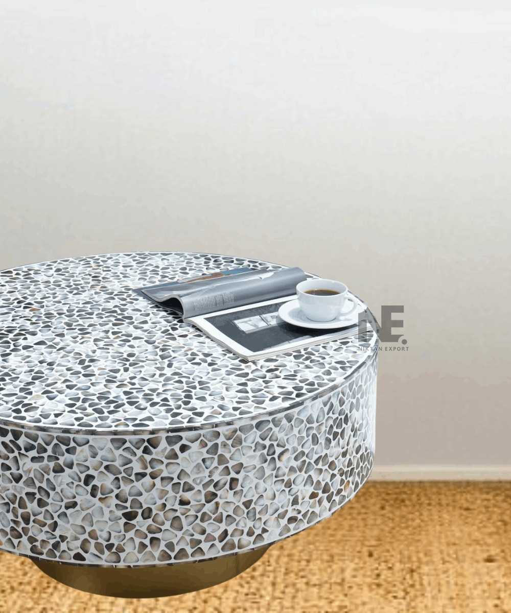 Side angle showing gold base and round top