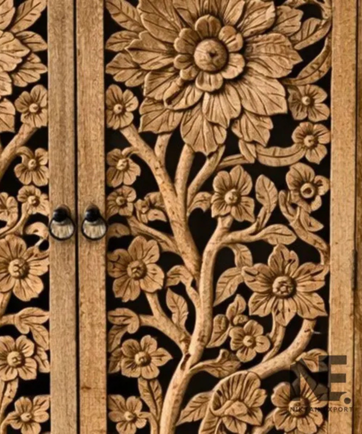hand carved wooden armoire with floral doors