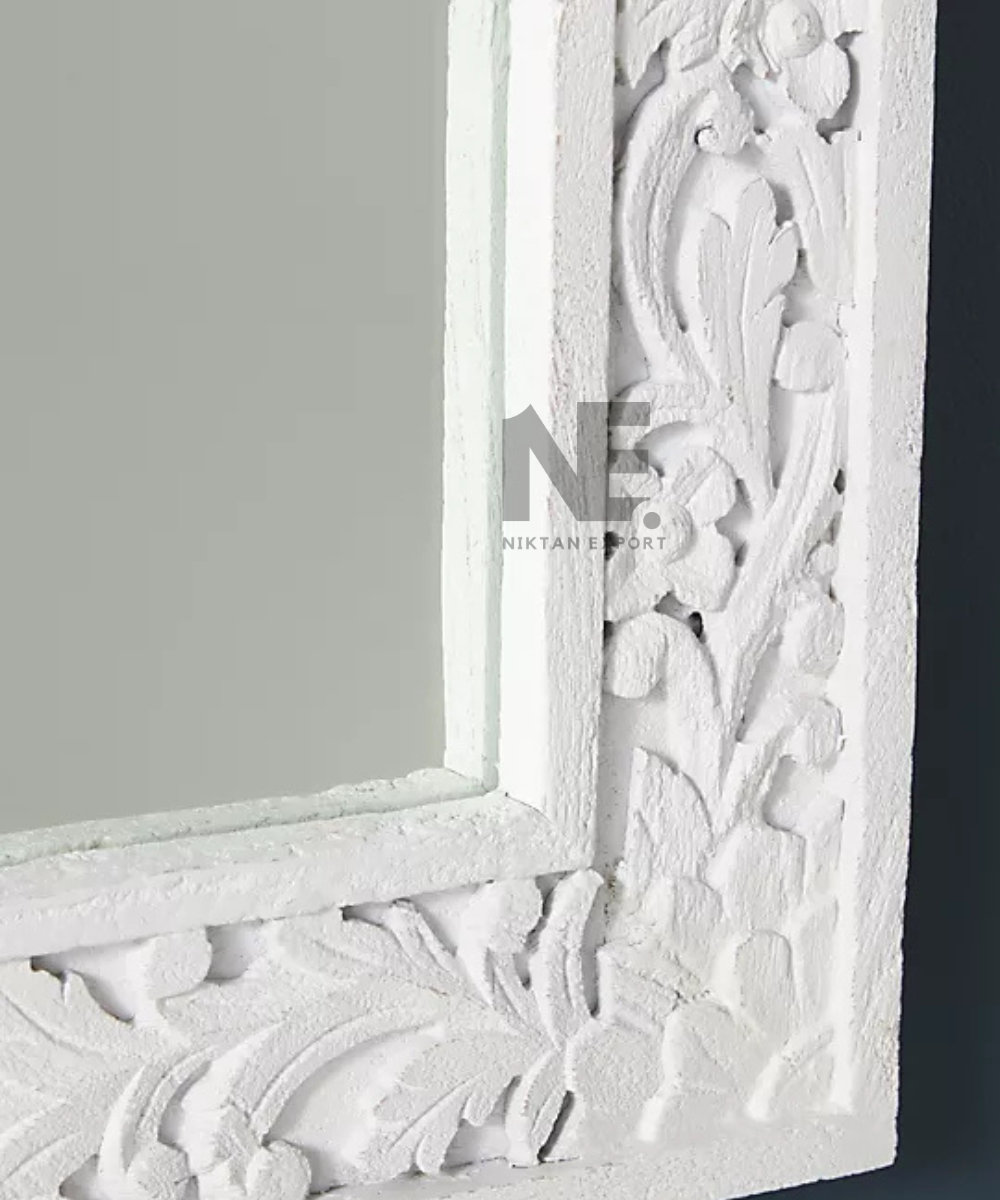 White mirror frame with raised floral detailing