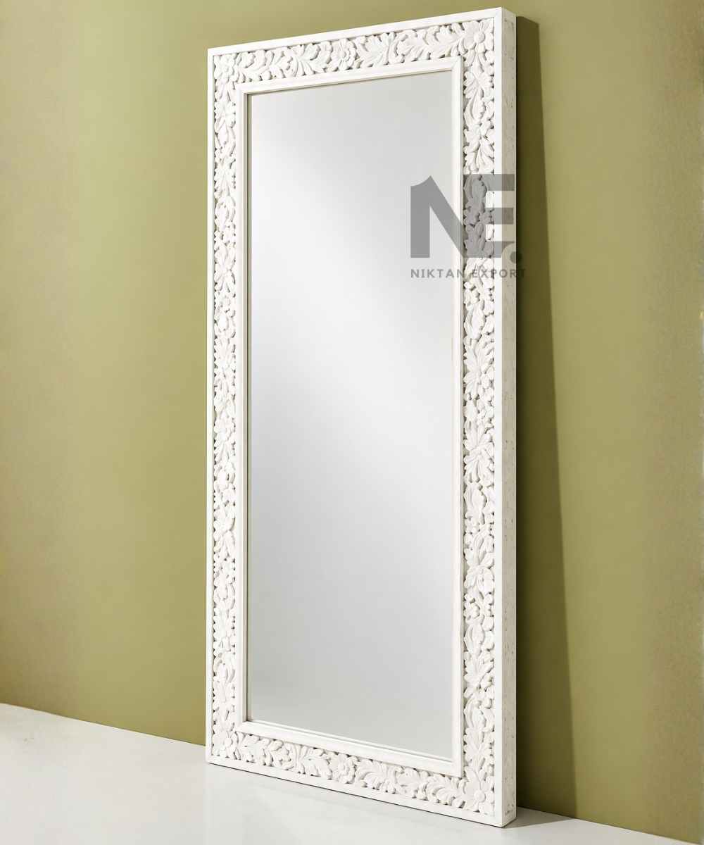 Close-up of floral details on white mirror frame