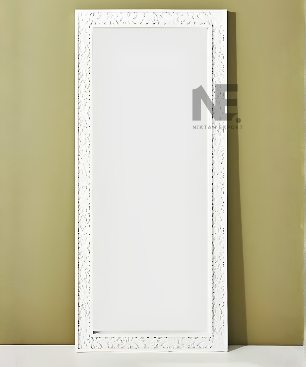 Ornate white mirror with carved leaf and flower patterns