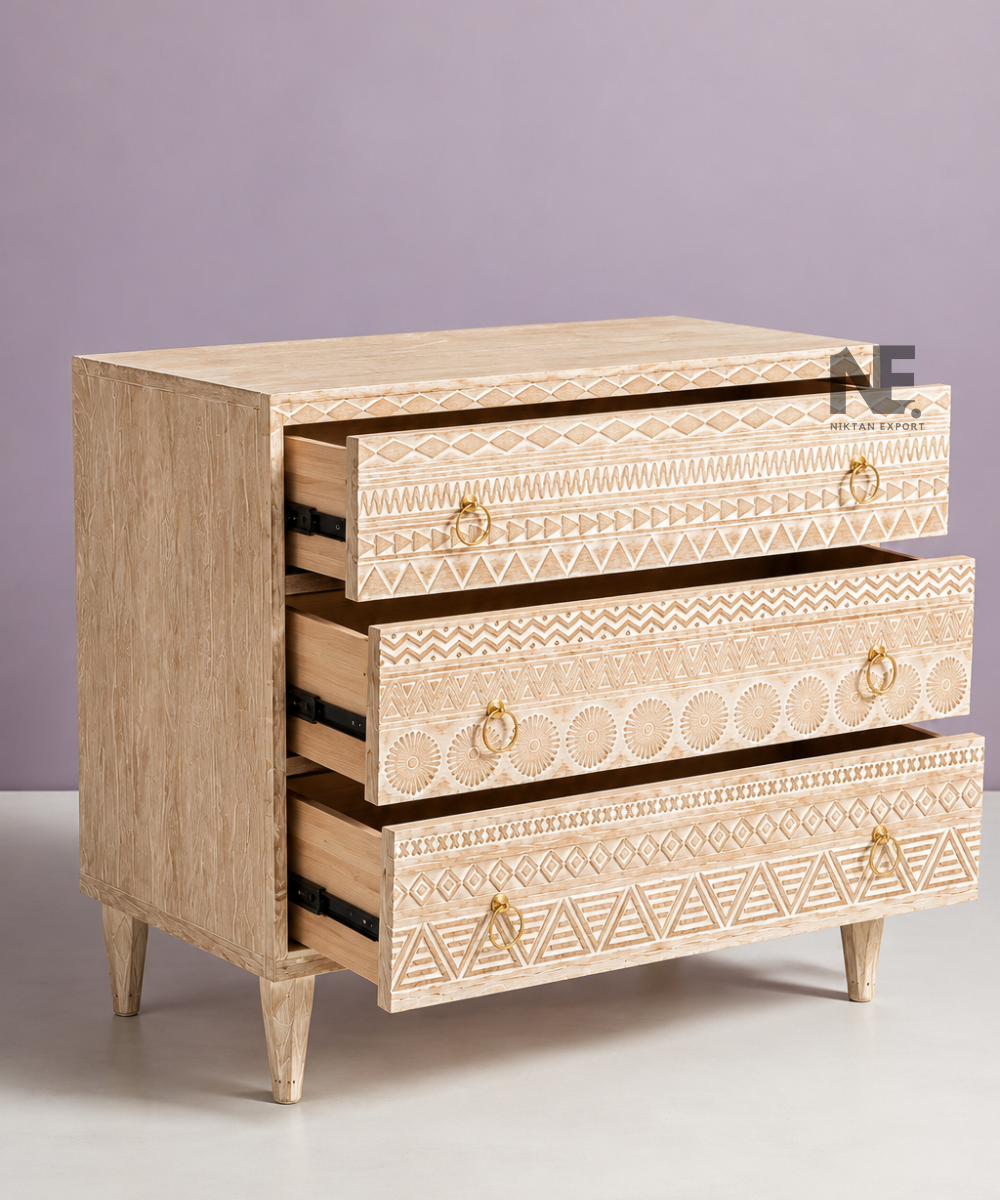 Three drawer wooden chest with carved geometric patterns