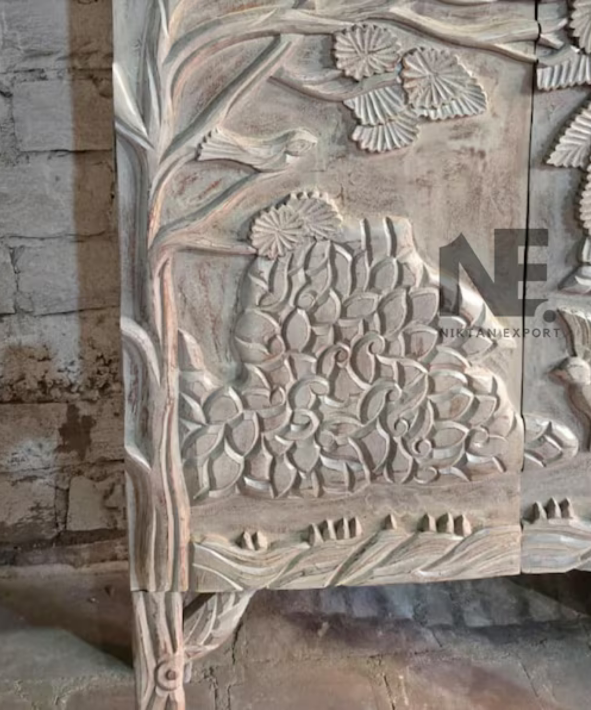 carved wooden bar cabinet with nature scene