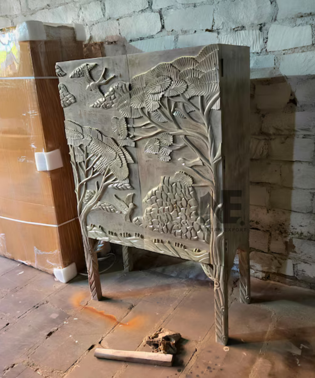 nature inspired carved mango wood cabinet