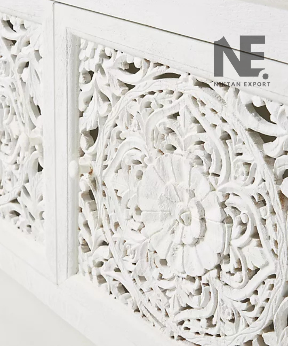 White bookcase with two decorative carved cabinet doors
