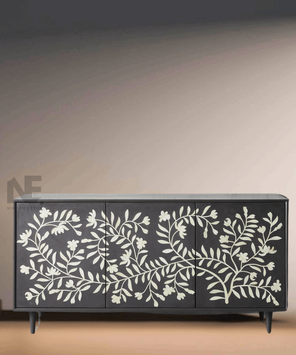 Close-up of detailed white floral bone inlay on black background
