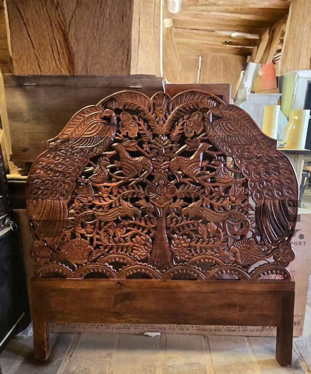 Peacock carved wooden bed with floral details