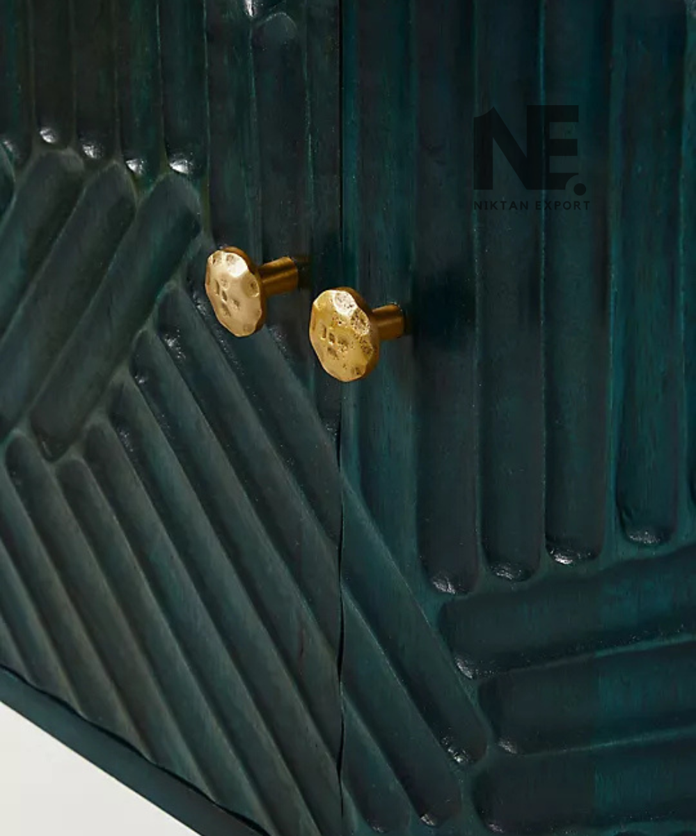 Close-up of floral scrollwork on navy blue cabinet