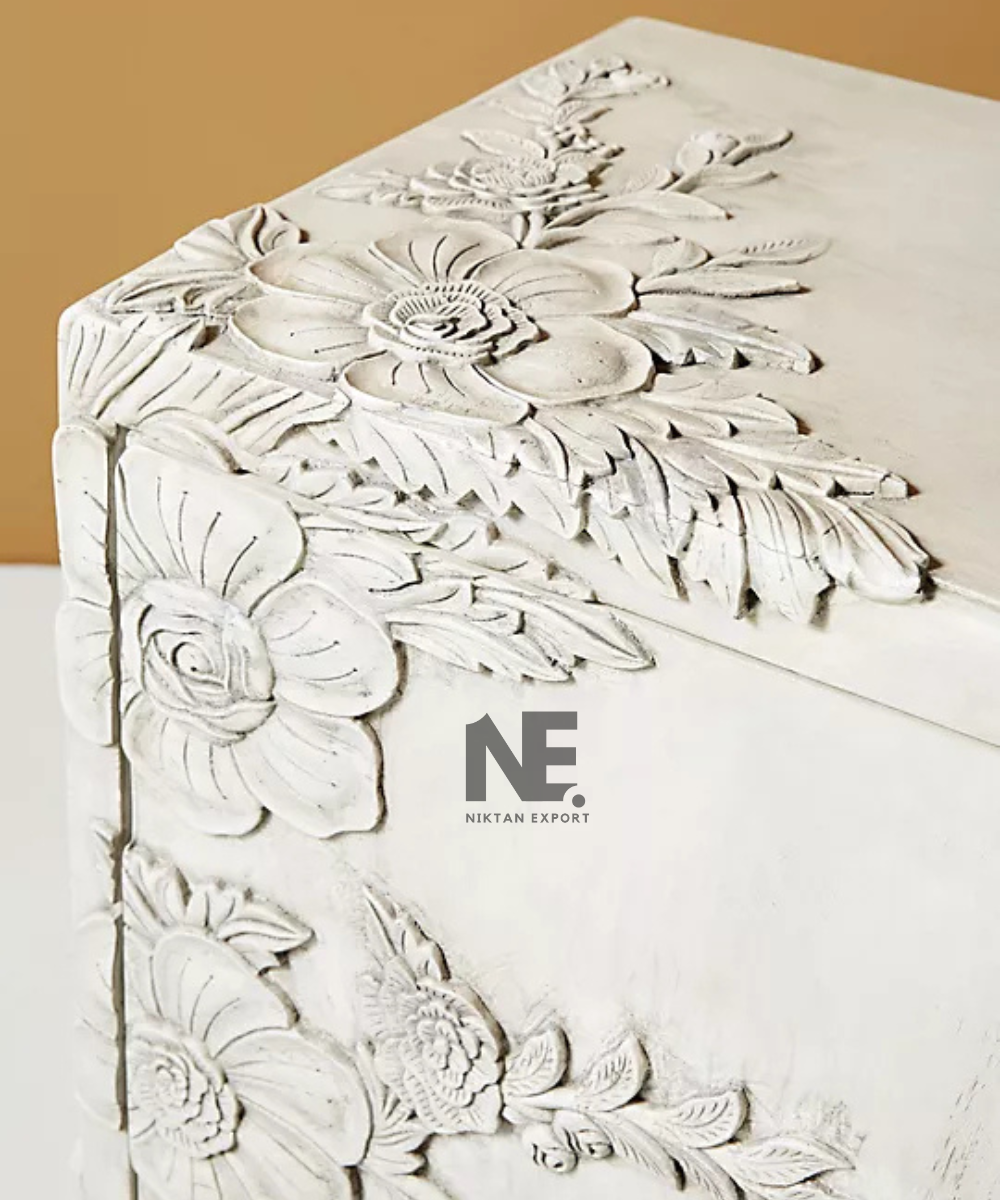 Floral carved cabinet with gold-tone knobs