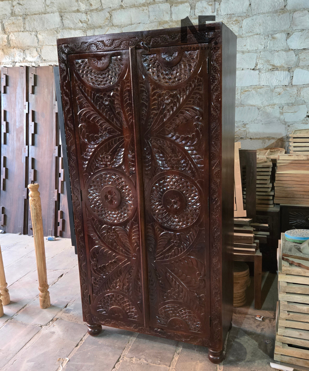 Close-up of decorative geometric carving on armoire doors