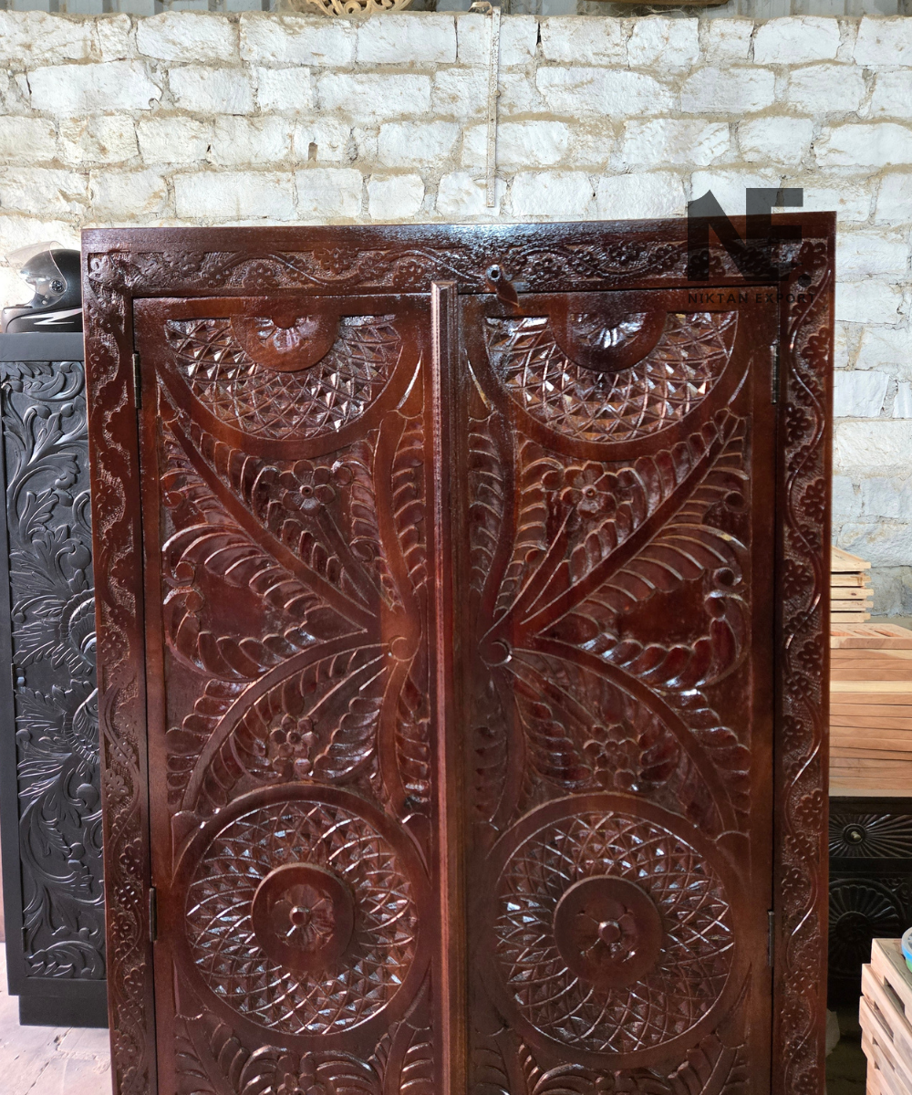 Two-door carved wooden cabinet with rounded feet