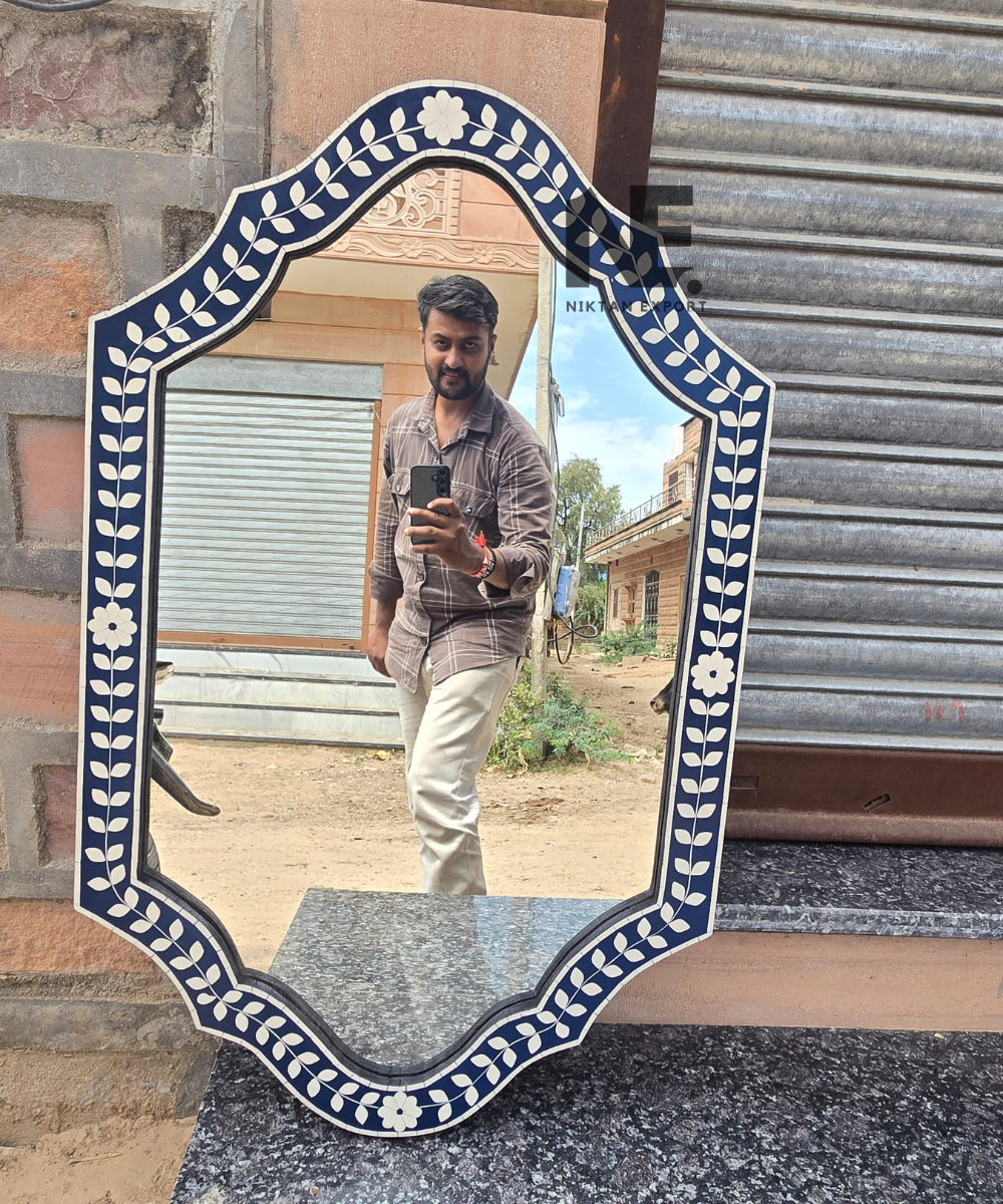 Ornamental wall mirror with cream botanical inlay