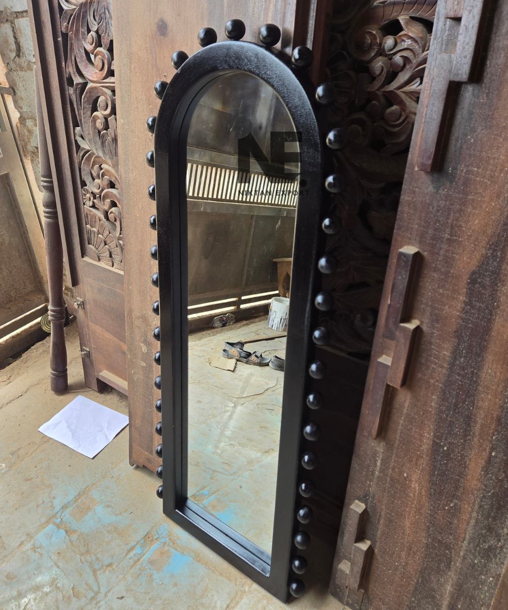 Front view of black decorative mirror with studded border