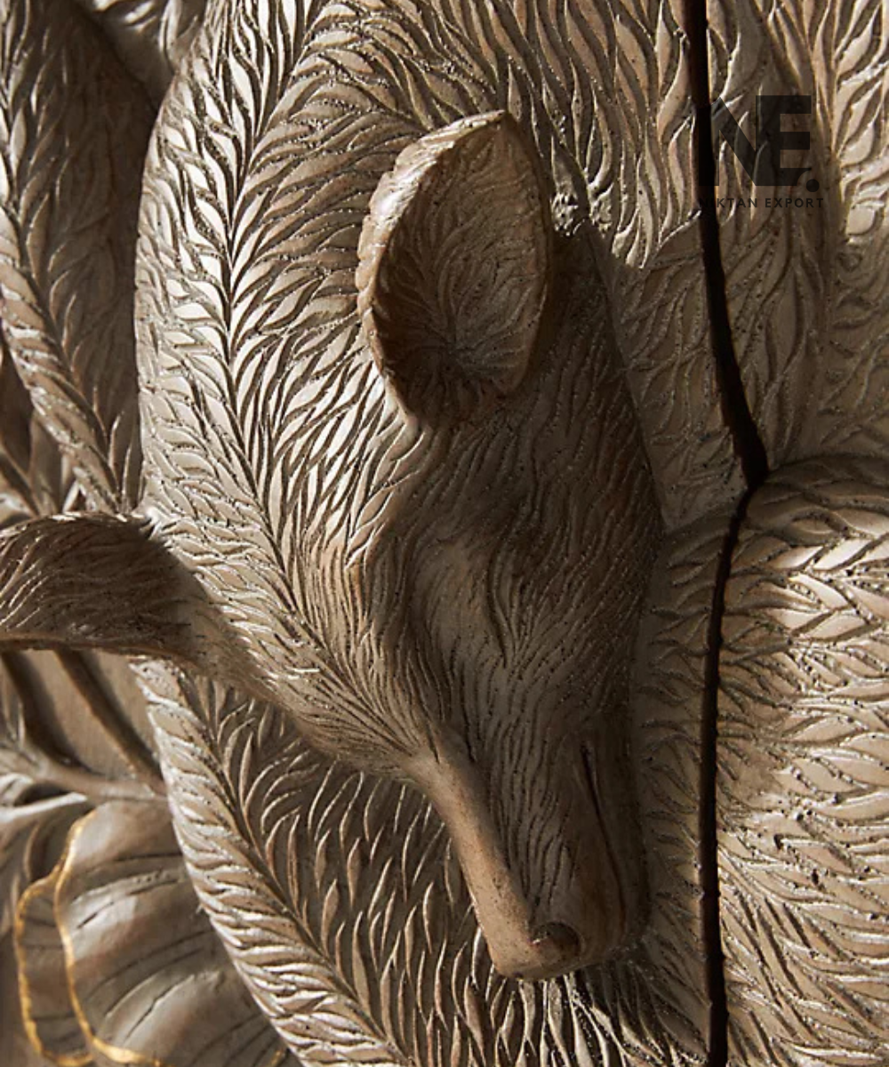 Detailed relief carving on fox-themed wall cabinet