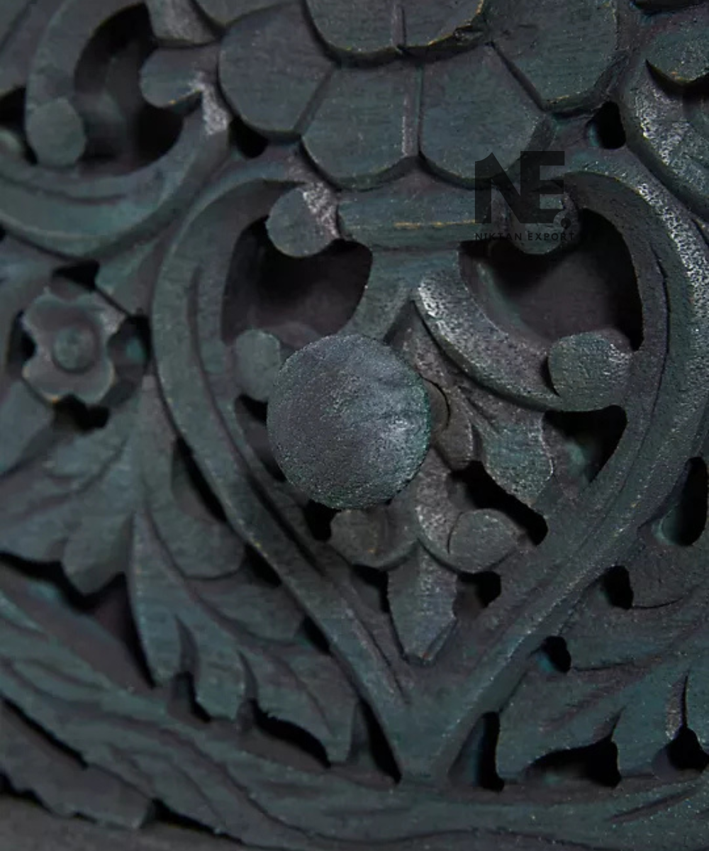 Close-up of floral medallion carving on bathroom vanity