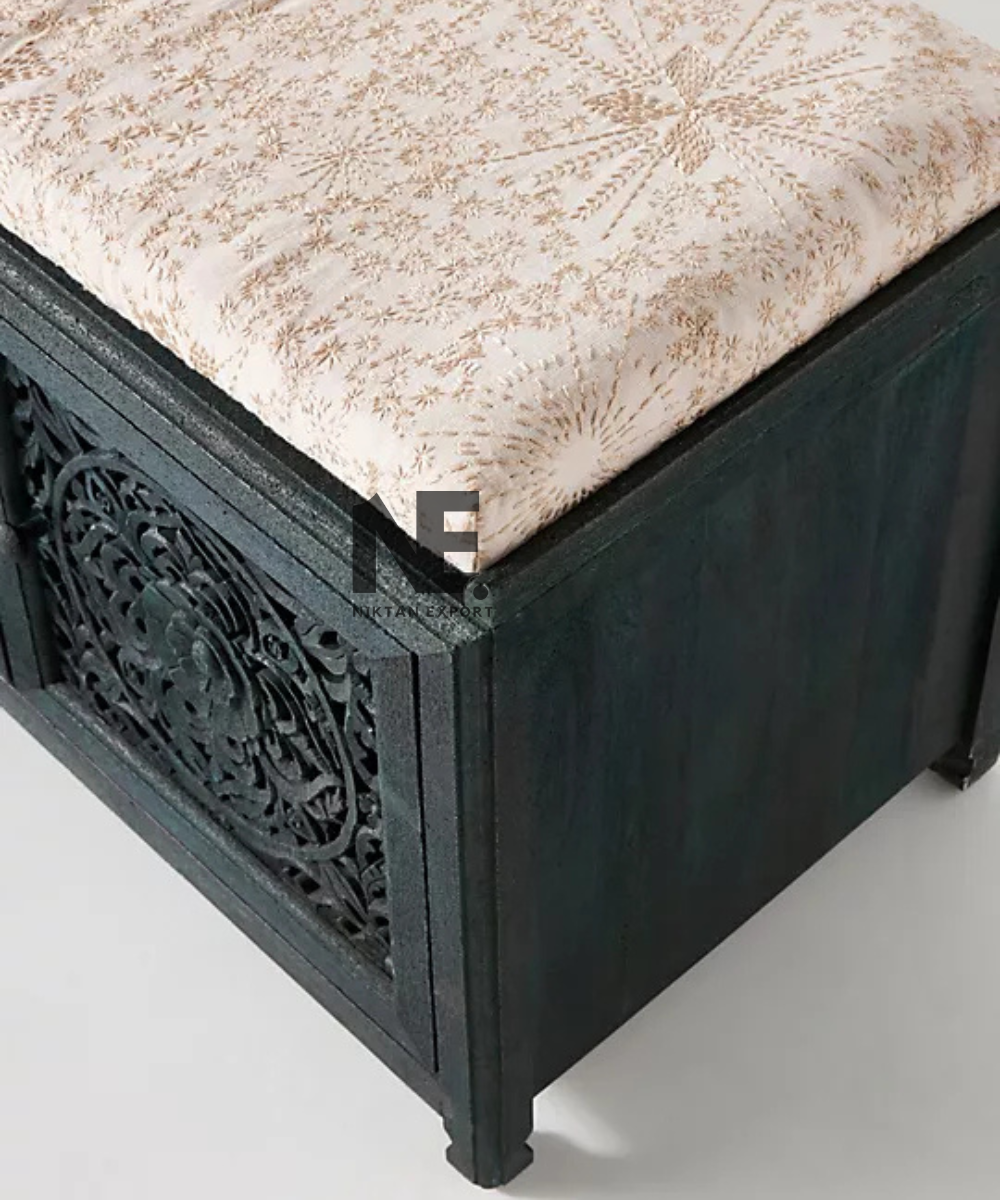 Dark teal wooden bench with traditional carved detailing
