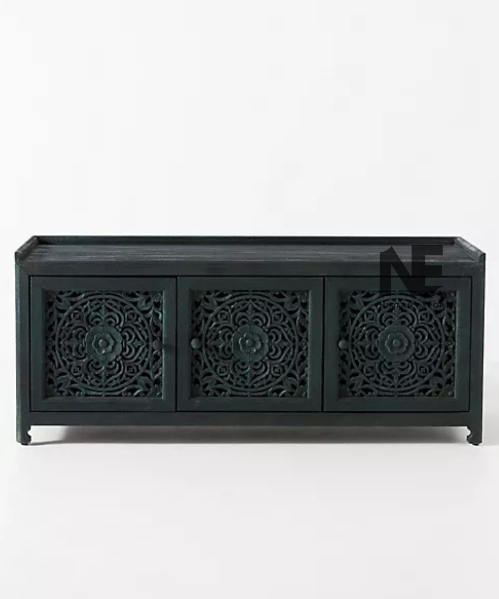 Carved wooden bench styled beneath a bay window