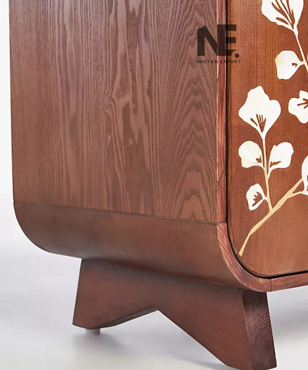 Brown accent cabinet with pale shell floral branches