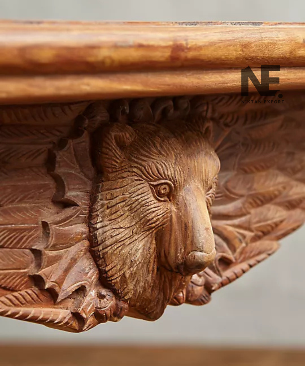 Close-up of carved animal motif on wooden table apron