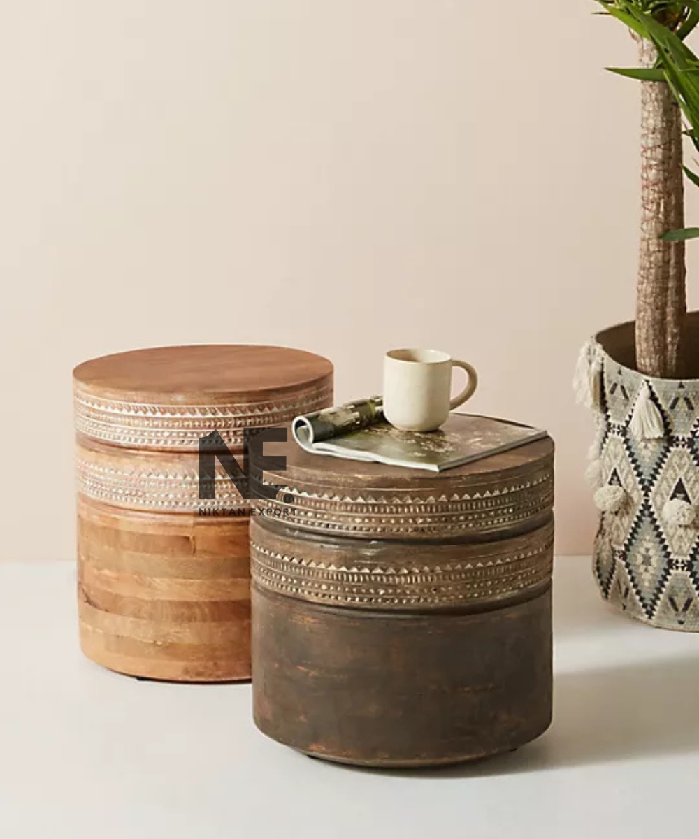 Cylindrical accent table with carved decorative detailing