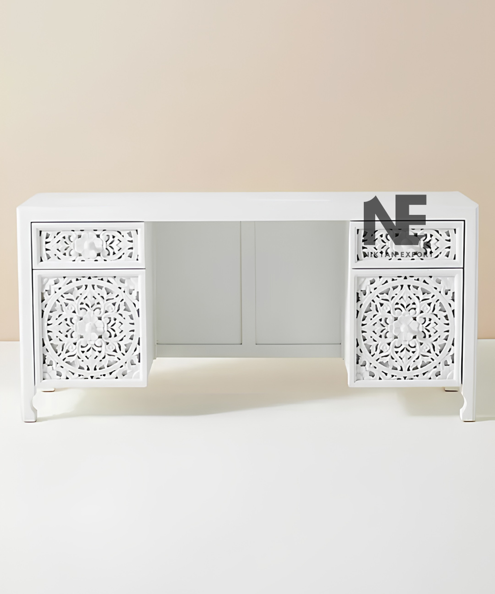 Front view of white wooden desk with ornate carved drawers
