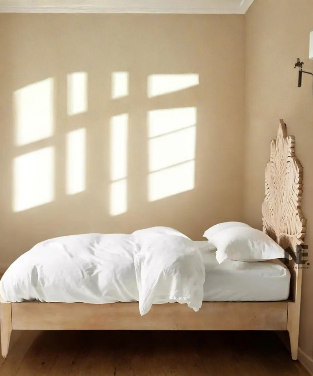 Hand-carved wooden bed with leaf headboard