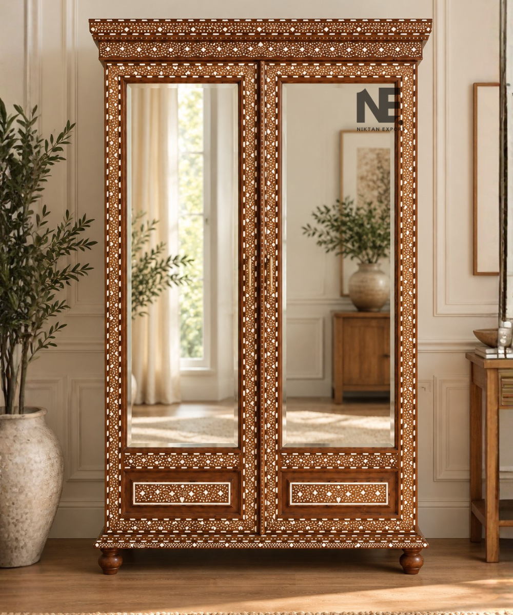 Ornate wooden armoire with two full-length mirrored doors