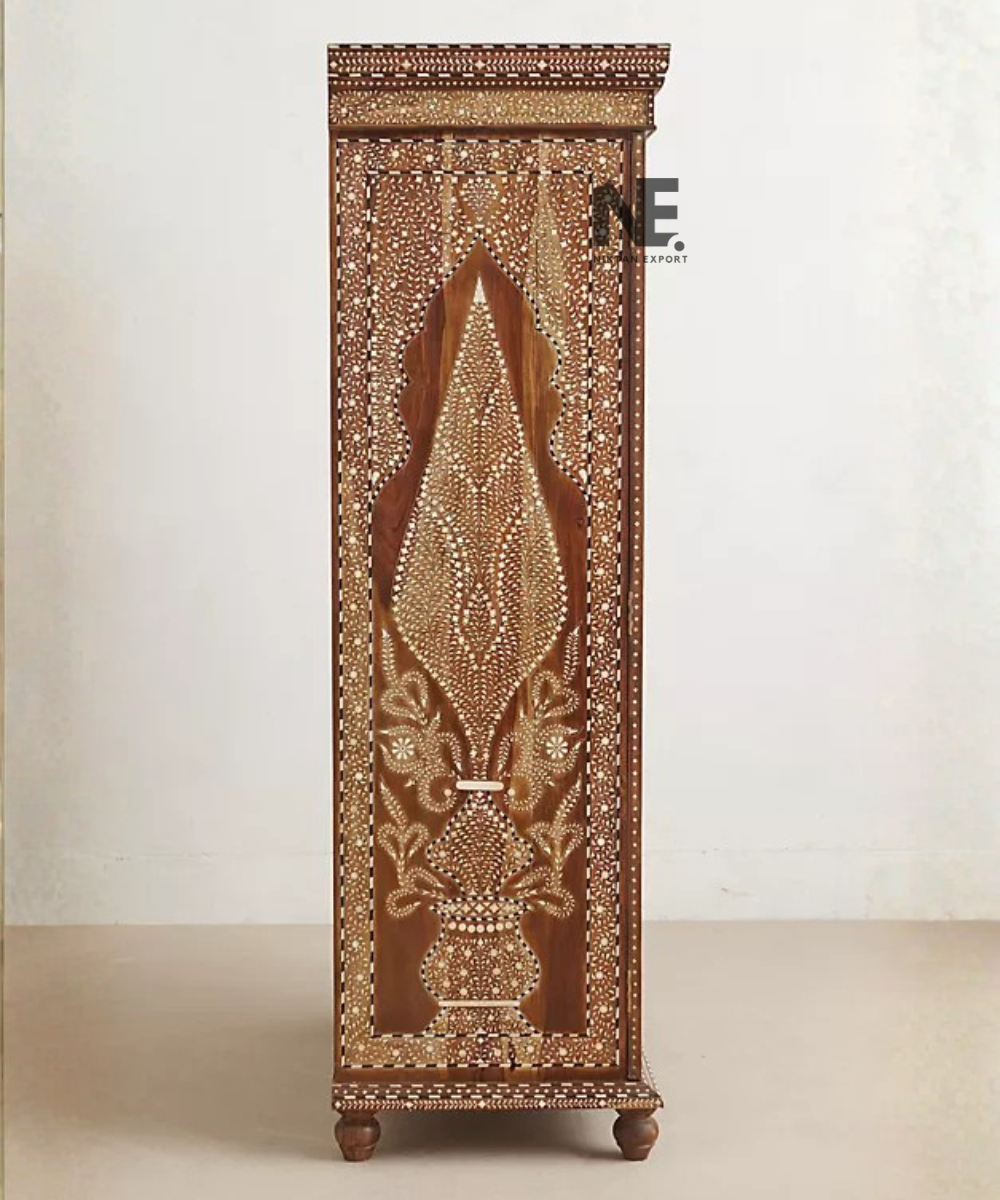 Close-up of decorative inlay on wooden armoire frame