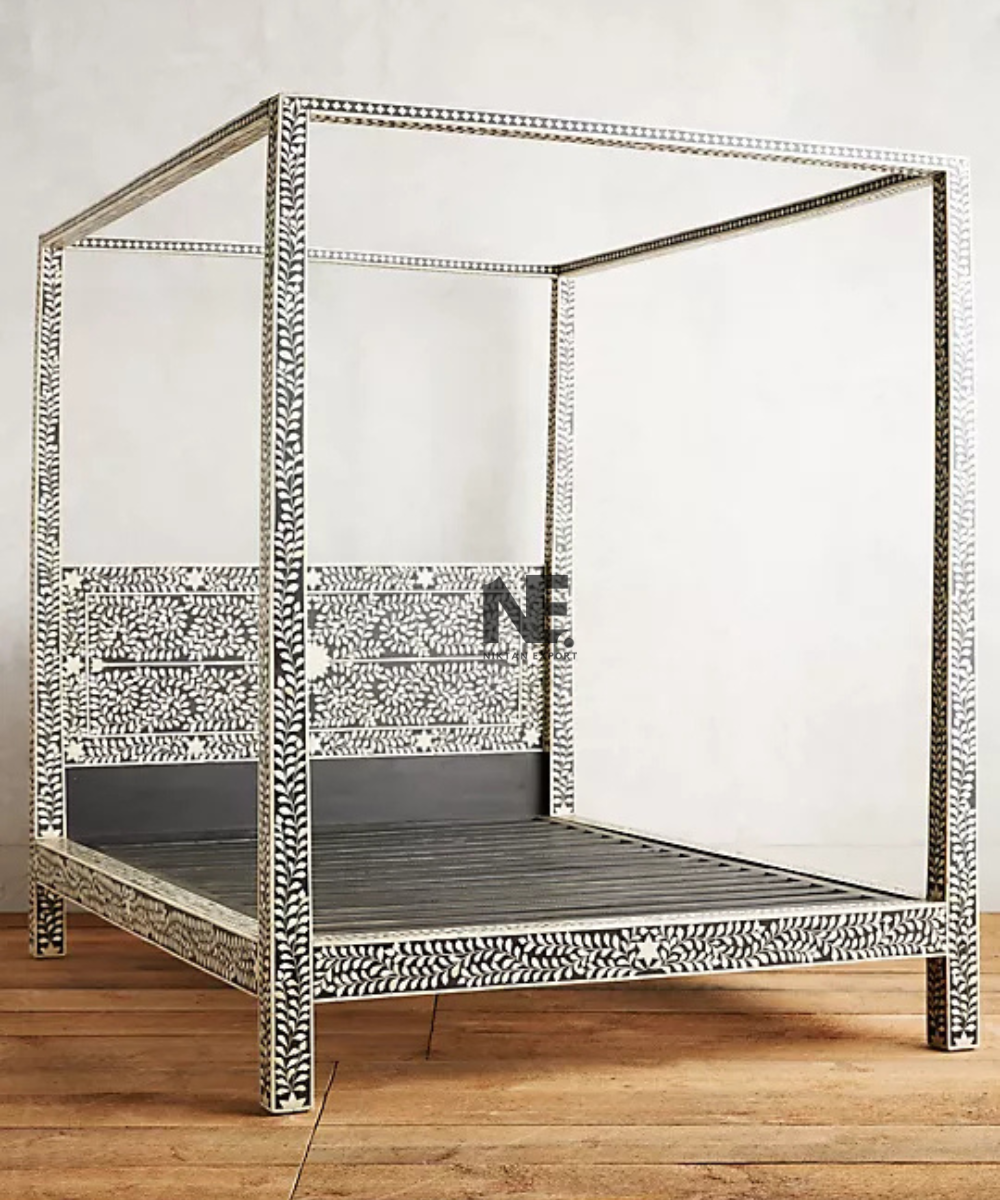 Black canopy bed with ivory leaf pattern
