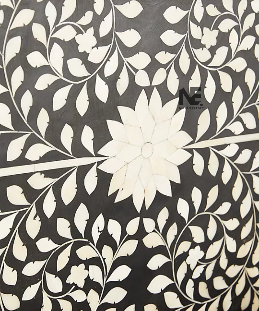Close-up of floral bone inlay on bed headboard