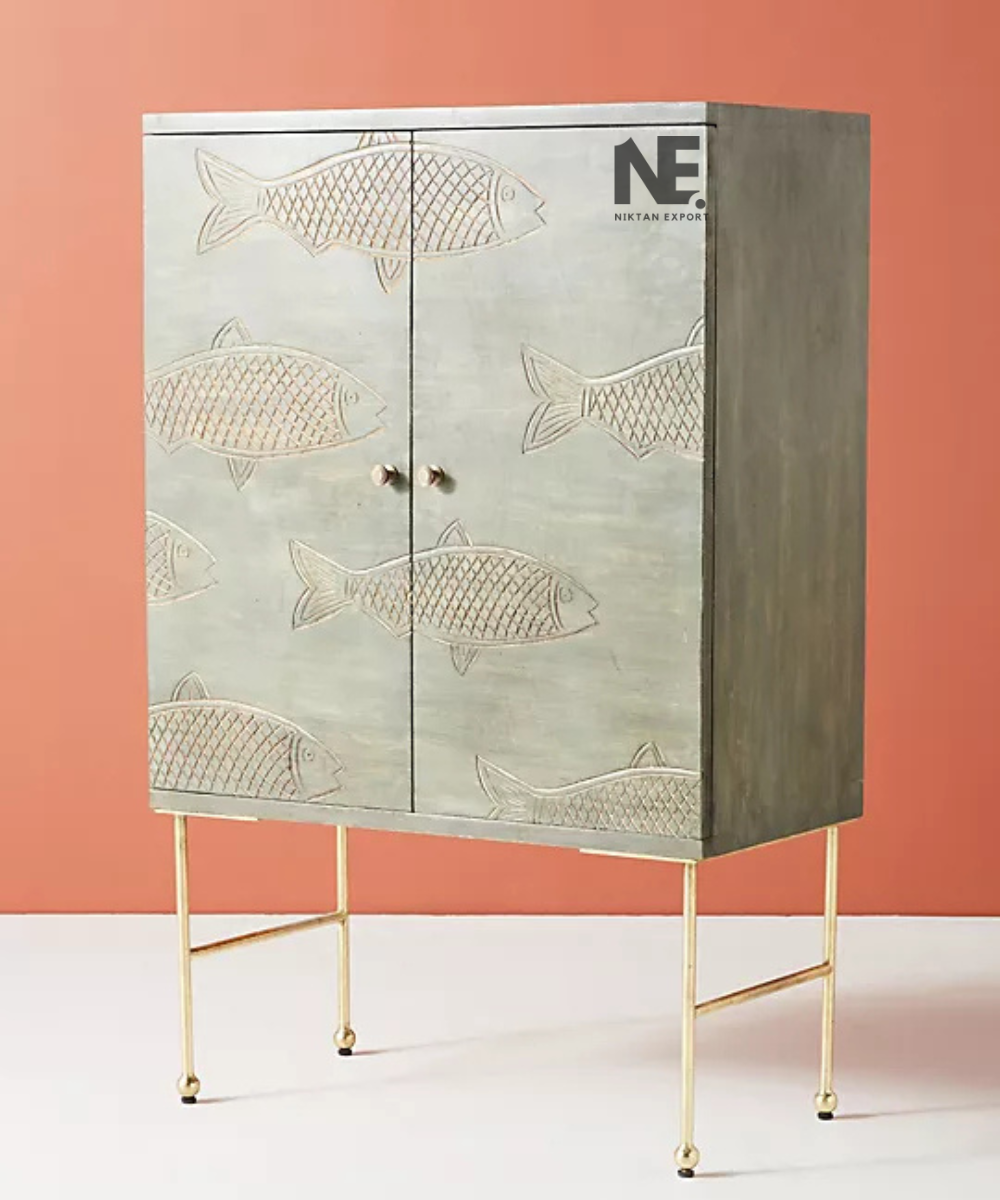 Front view of green two-door cabinet with decorative fish design