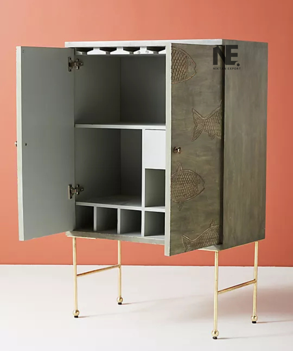 Decorative fish motif on distressed green cabinet doors