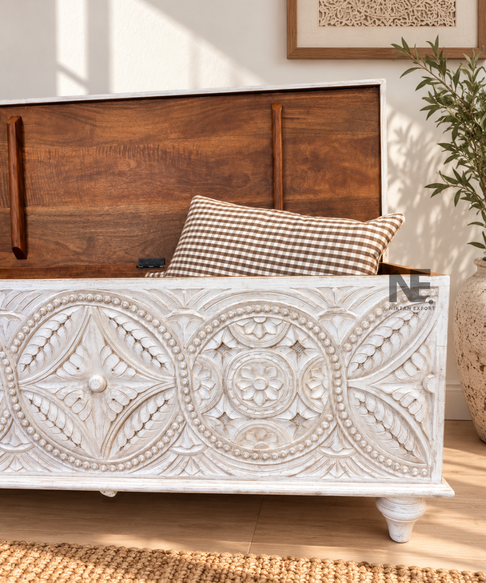 Whitewashed wooden storage chest with traditional carved motifs