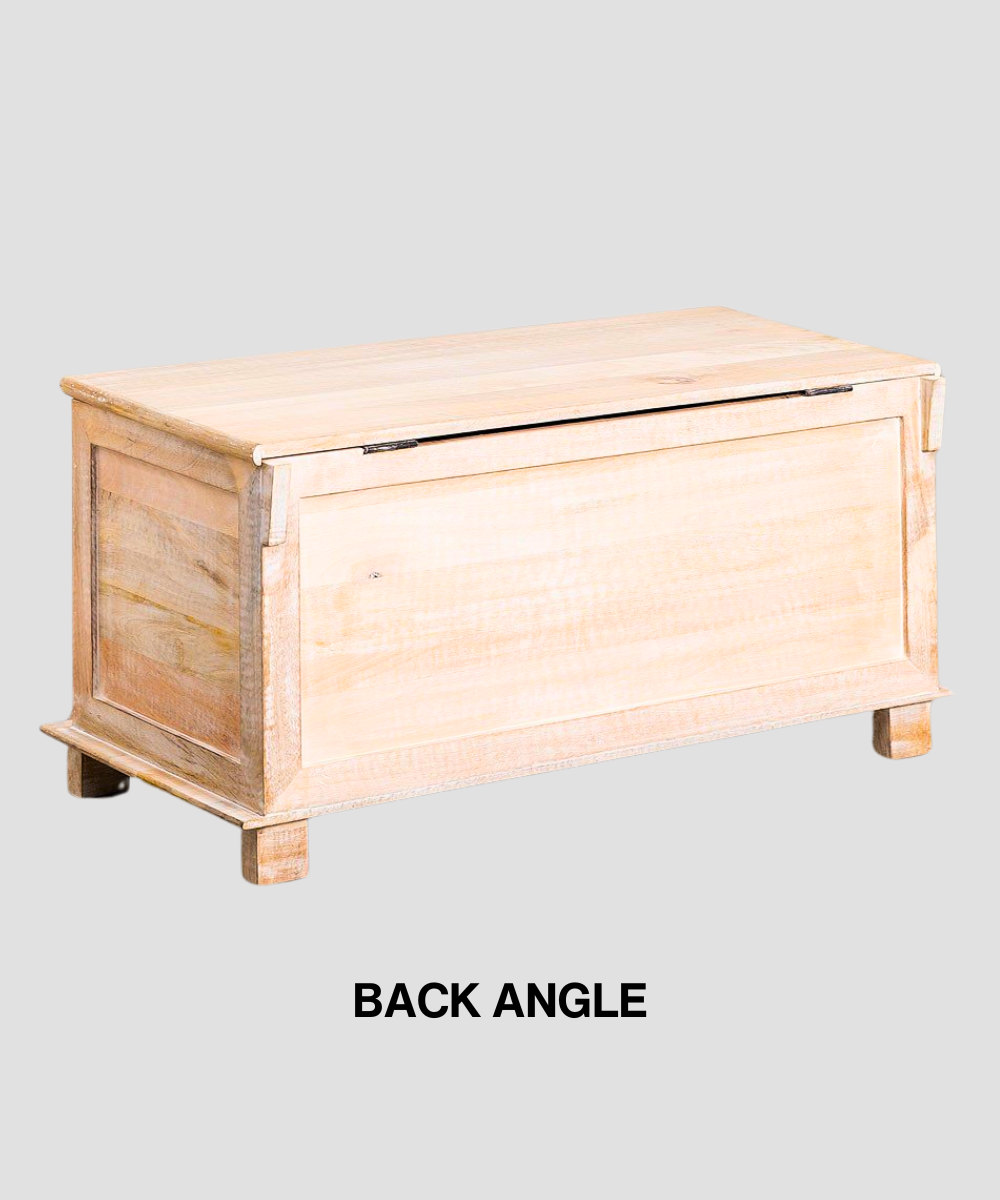 Trunk styled at the foot of a bed for storage inspiration