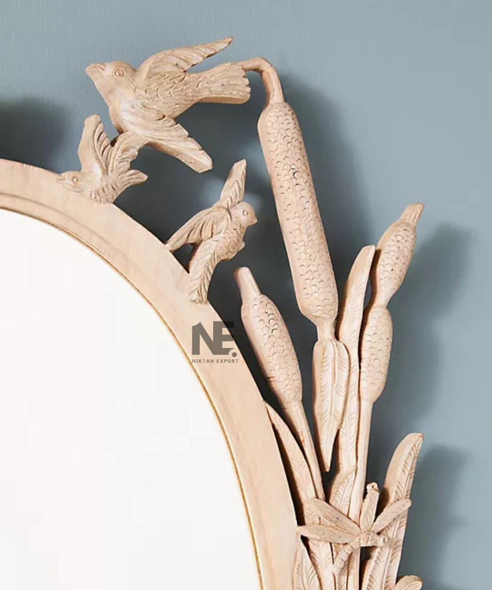 Detailed reed and leaf carvings on a wooden mirror