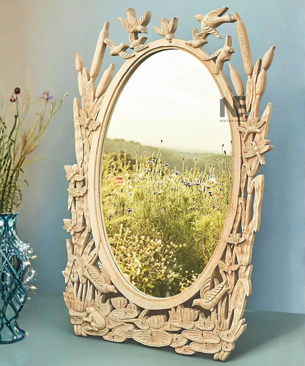 Close-up of bird carvings on a decorative wooden mirror