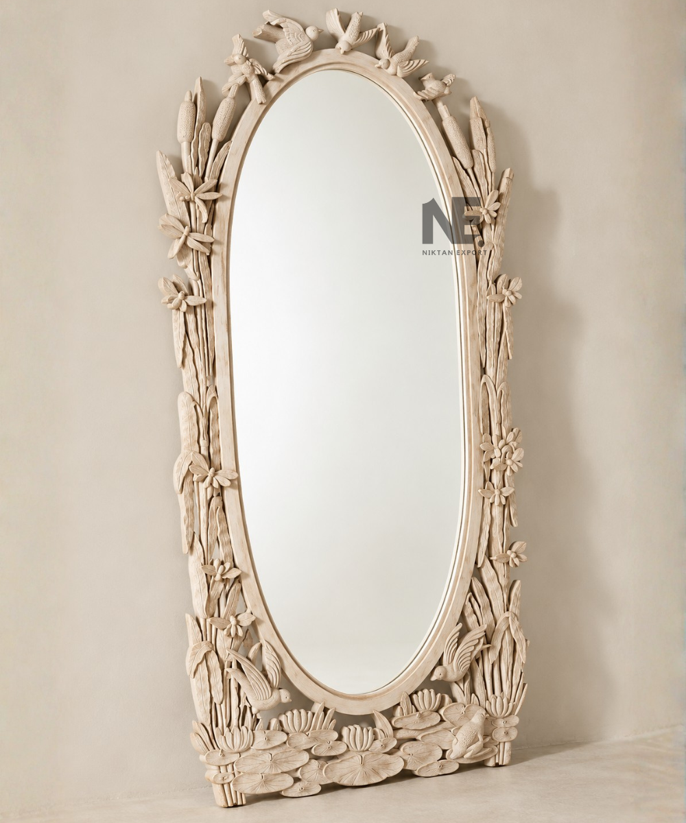 Tall oval floor mirror with hand-carved bird details