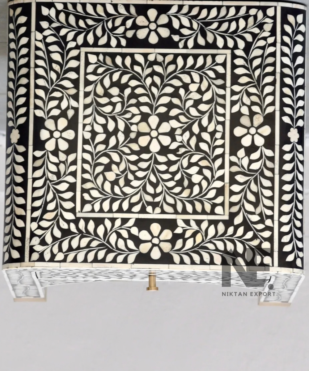 Black bedside table with ivory floral detailing