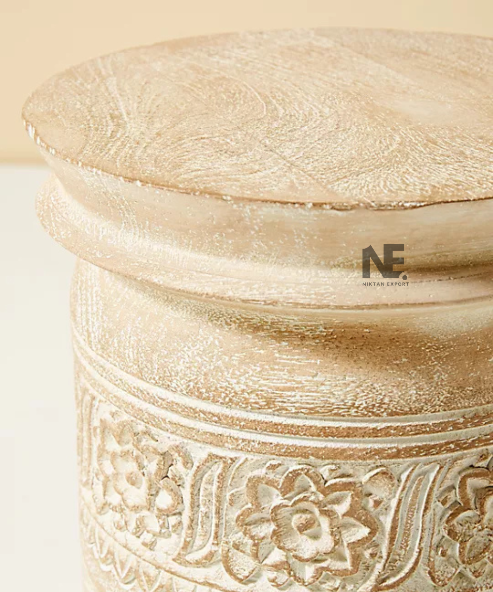 Close-up of floral detailing on cream side table