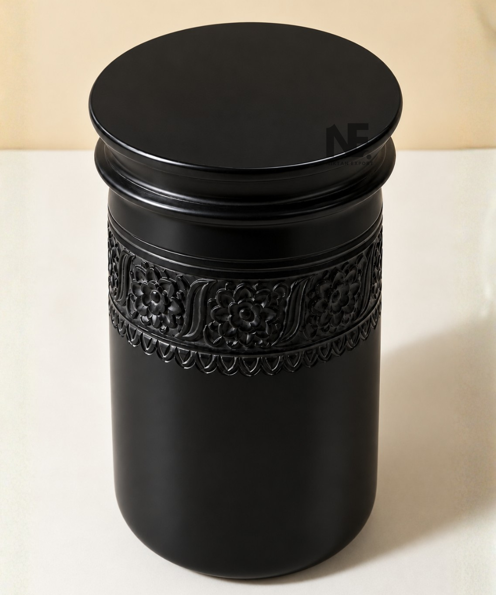 Close-up of floral detailing on black side table