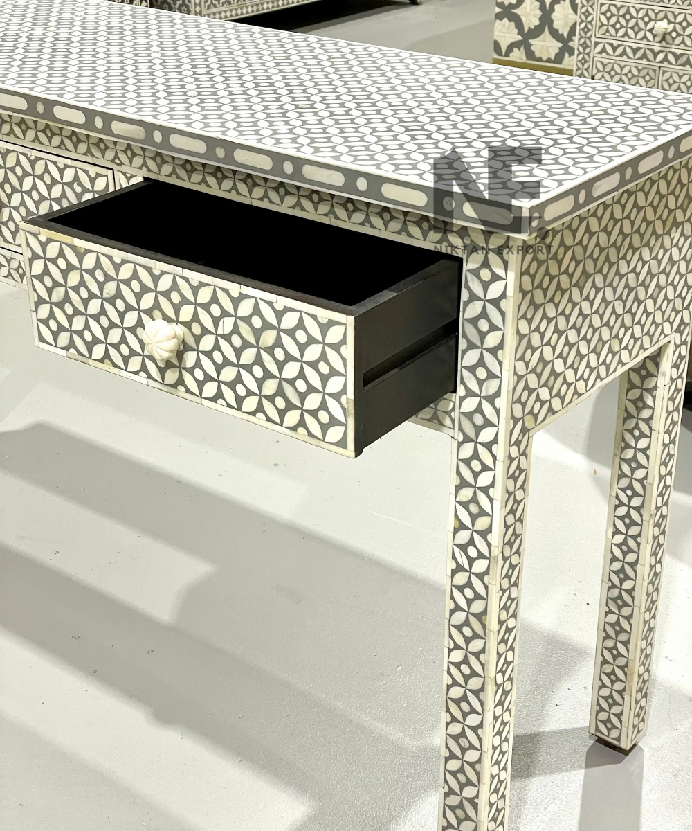 Geometric inlay pattern on console table drawers