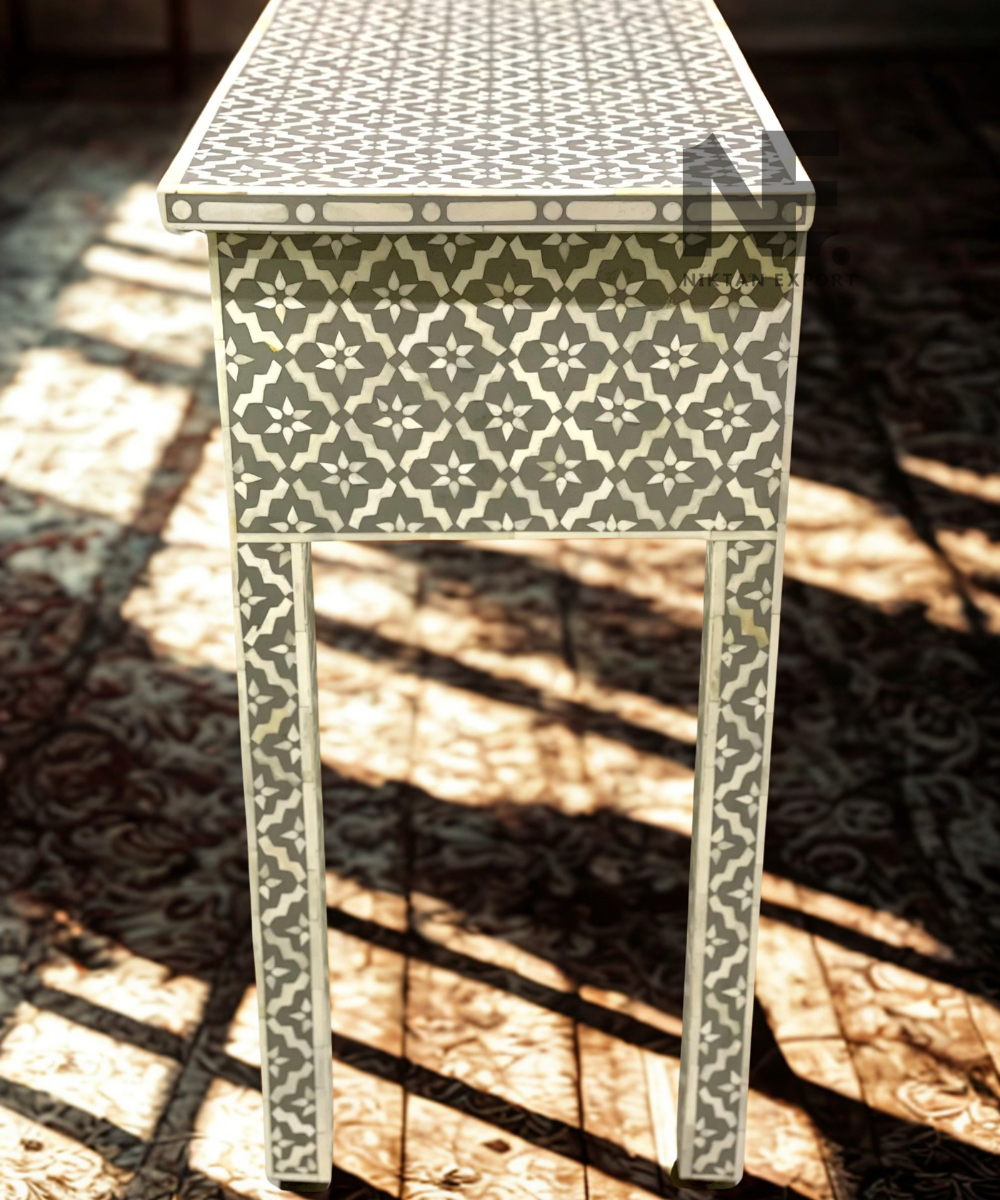 9. Bone inlay console table with patterned legs

 