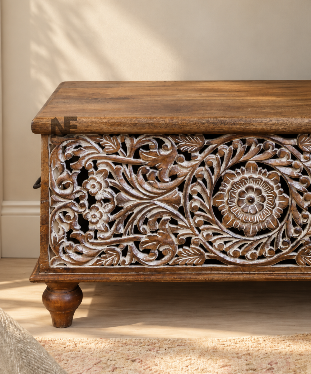 Close-up of decorative floral scrollwork on wooden storage trunk
