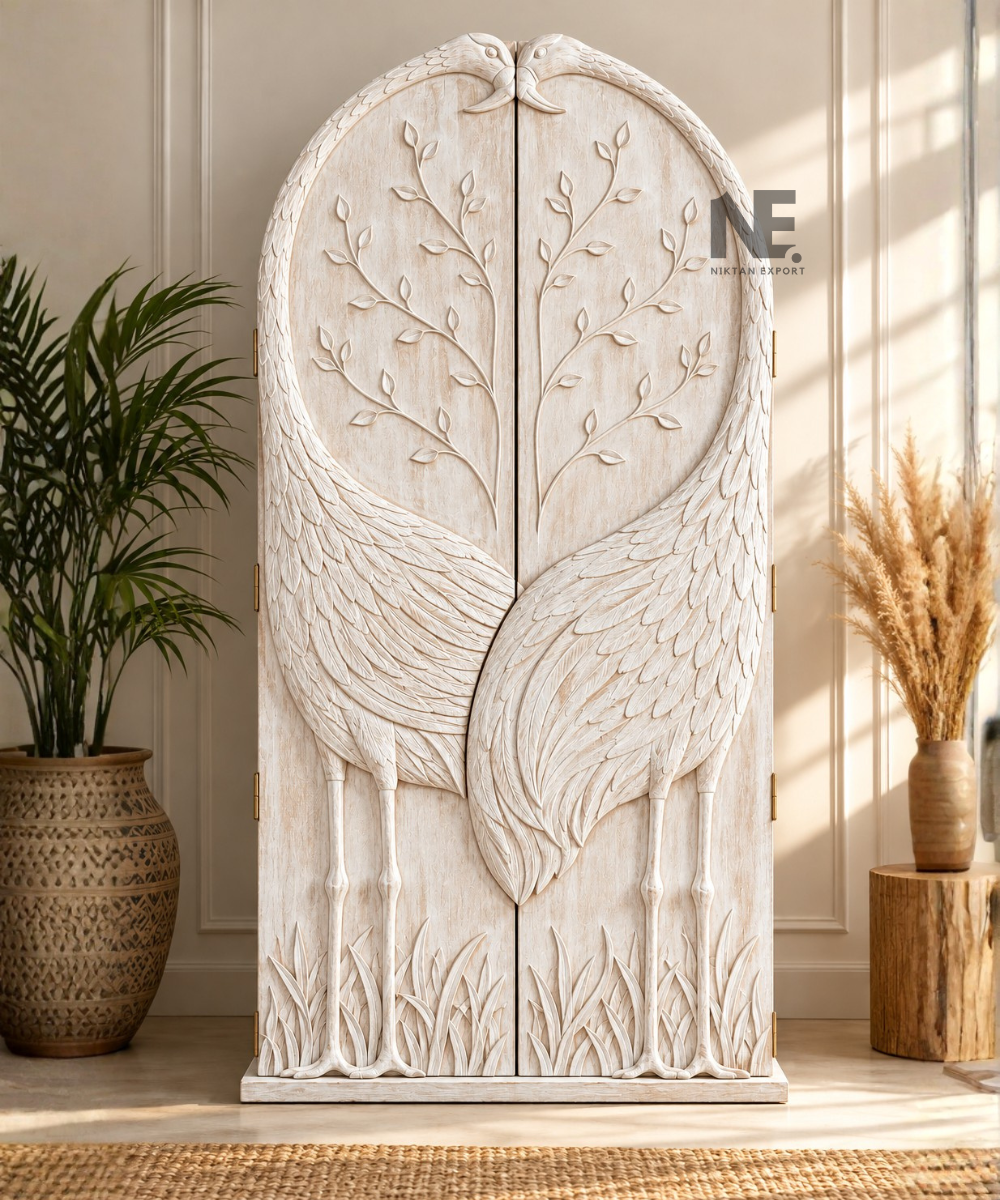 Wooden wardrobe featuring two sculpted birds on the doors