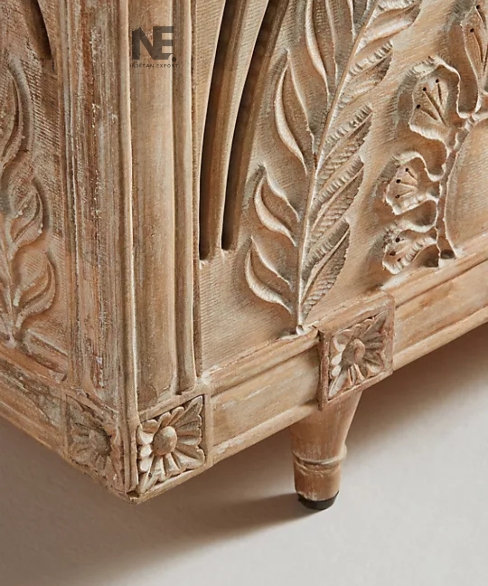 Leaf-pattern detailing on carved wooden storage chest