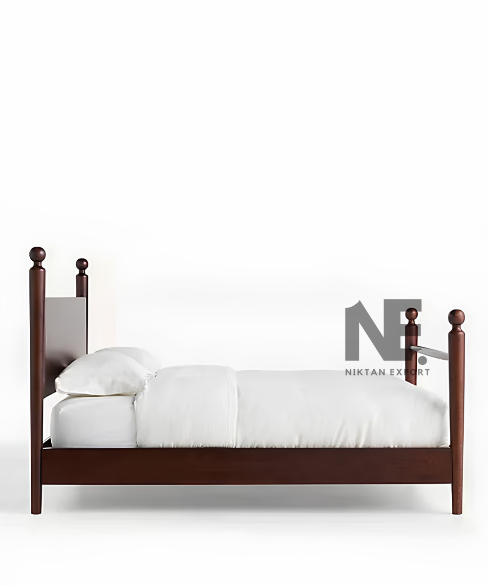 Close-up of rounded finial on dark brown bedpost