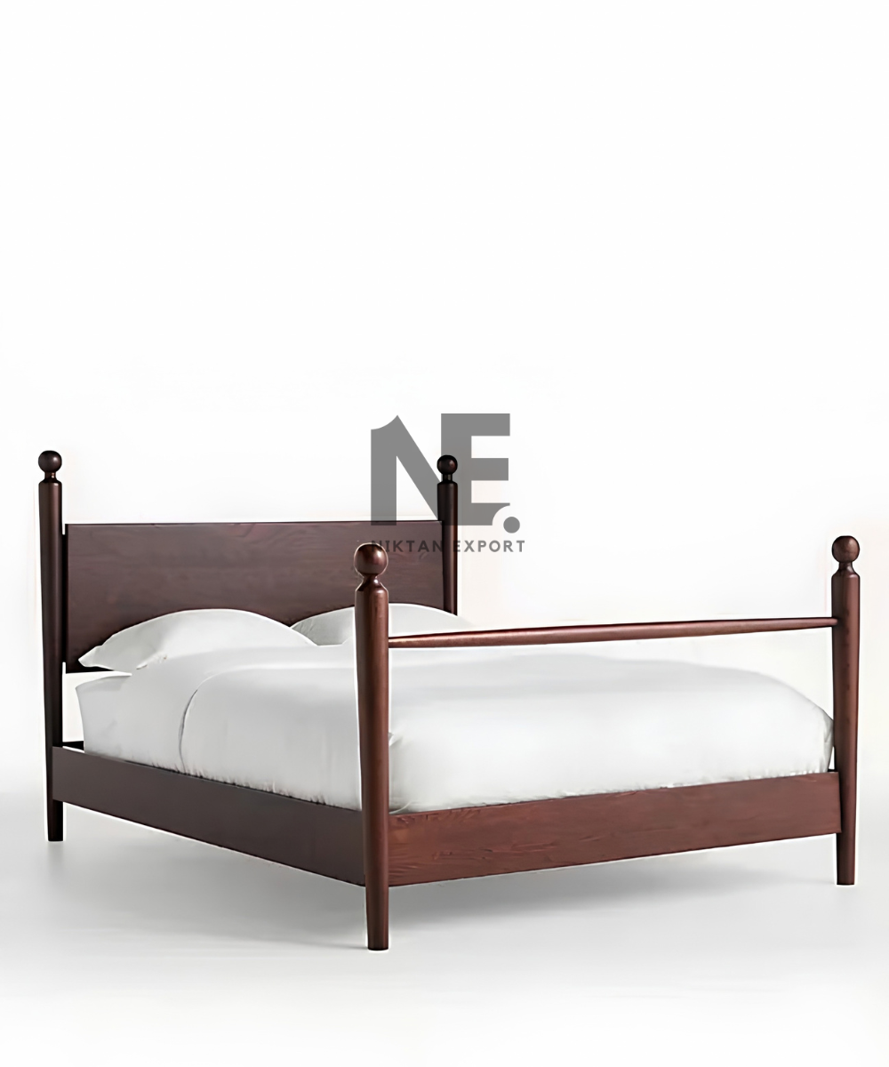 Traditional wooden bed with four decorative posts